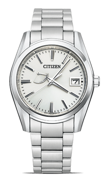 This image showcases a Citizen Eco-Drive watch with a silver-toned case and metal bracelet. It features a white dial with subtle hour markers, a date window, and a unique power reserve indicator, all against a plain background.