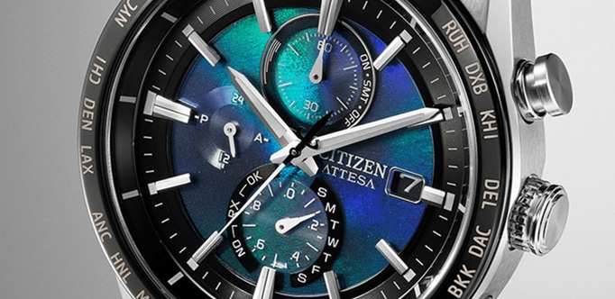 Citizen Attesa Uhr mit blau-grünem Zifferblatt, Zeit- und Datumsanzeige.