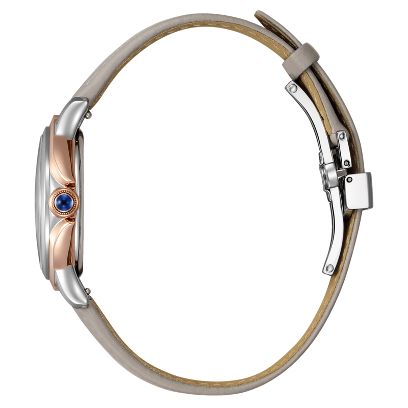 Seitenansicht einer silber- und roségoldfarbenen Uhr mit grauem Lederarmband.