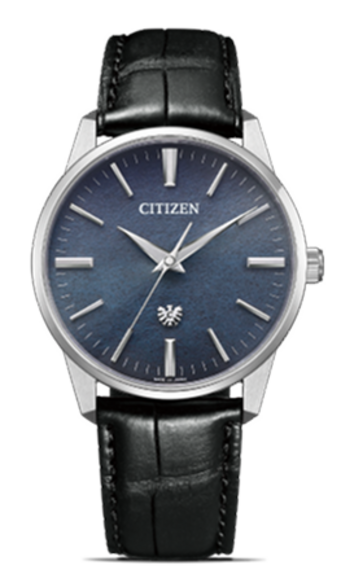 This image showcases a Citizen watch with a silver-toned case and a black crocodile-embossed leather strap. It features a textured blue dial with applied hour markers and slender hands, all against a plain black background, exuding elegant simplicity.