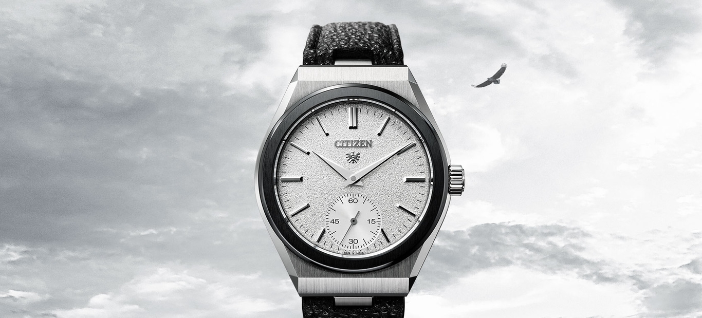 This image features an elegant Citizen watch with a silver-toned case and textured white dial, complemented by a dark, possibly leather, strap. A sub-seconds dial is at 6 o'clock. A lone bird, likely an eagle, soars in the cloudy sky above.