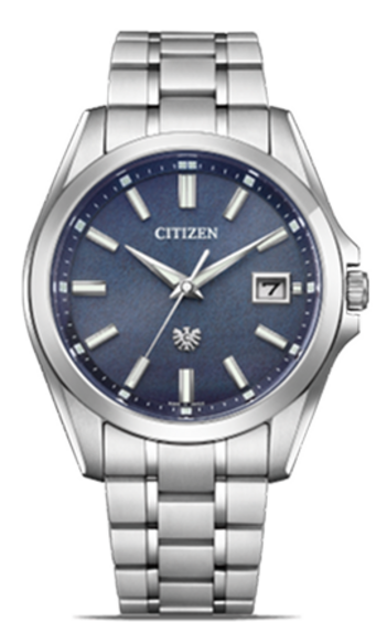 This image showcases a Citizen watch with a silver-toned case and metal bracelet. It features a textured blue dial with applied hour markers, a date window, and a subtle eagle emblem, all against a plain background.