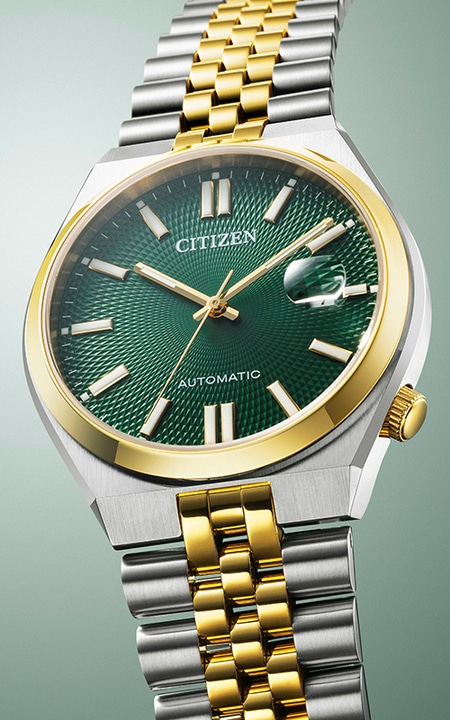 Citizen-Uhr mit grünem Zifferblatt und goldenen Akzenten, Automatikwerk, Edelstahlarmband.